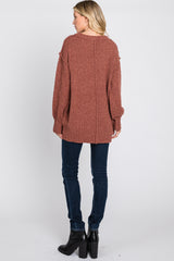 Rust Textured Knit Exposed Seam Sweater