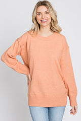 Peach Exposed Seam Sweater