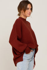 Rust Mock Neck Exposed Seam Sweater